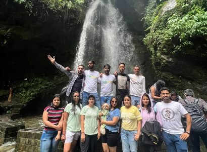 Triptoo group enjoying Jibhi Waterfall in Tirthan Valley Himachal Pradesh