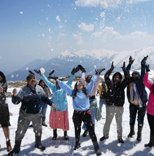 `Kashmir tour package with scenic Dal Lake, snow-capped mountains and traditional houseboats`