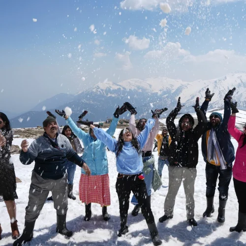 `Kashmir tour package with scenic Dal Lake, snow-capped mountains and traditional houseboats`